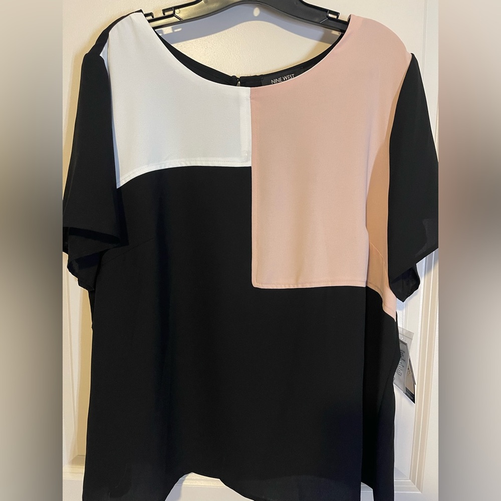Nine West blouse with black, white and pink color blocking. New with tags.